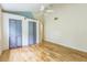 Bedroom with hardwood floors, ceiling fan, and double closets at 13619 Twin Lakes Ln # 15, Tampa, FL 33618
