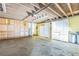 Organized garage space featuring built-in white and natural wood cabinets, providing ample storage solutions at 13619 Twin Lakes Ln # 15, Tampa, FL 33618