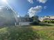 Enclosed patio and grassy backyard at 13619 Twin Lakes Ln # 15, Tampa, FL 33618