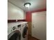 Laundry room with washer, dryer, and ample storage at 13619 Twin Lakes Ln # 15, Tampa, FL 33618