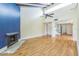 Open-concept living room with vaulted ceilings, a brick fireplace, and hardwood flooring at 13619 Twin Lakes Ln # 15, Tampa, FL 33618