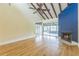Open living room with vaulted ceiling, ceiling fan, hardwood floors and fireplace at 13619 Twin Lakes Ln # 15, Tampa, FL 33618