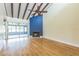 Spacious living room with hardwood flooring, vaulted ceiling, and fireplace at 13619 Twin Lakes Ln # 15, Tampa, FL 33618