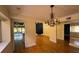Elegant dining room with hardwood floors and chandelier at 13619 Twin Lakes Ln # 15, Tampa, FL 33618