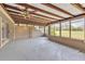 Bright, enclosed patio with view of lush green landscape and golf course at 13619 Twin Lakes Ln # 15, Tampa, FL 33618