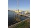 Private boat lift on a wooden dock, perfect for boating enthusiasts at 501 55Th Ave, St Pete Beach, FL 33706