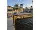 Waterfront property with dock and seating area at 501 55Th Ave, St Pete Beach, FL 33706
