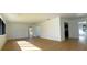 Bright and airy living room with light wood floors and plenty of natural light at 2239 Worrington St, Sarasota, FL 34231