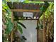 Outdoor grill area with a covered structure and wooden details at 5400 Circle Dr, Weeki Wachee, FL 34607
