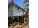 Elevated home with wooden stairs at 707 George S St, Tarpon Springs, FL 34688
