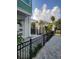 Back patio with pergola, black fence, and gate at 2819 1St S Ave, St Petersburg, FL 33712