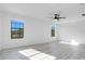 Spacious bedroom with light grey vinyl flooring and large windows at 1708 Hadden Hall Pl, Trinity, FL 34655