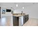 Kitchen island with granite countertop and stainless steel dishwasher at 1708 Hadden Hall Pl, Trinity, FL 34655