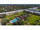 Aerial view of community, pool, and surrounding landscape at 5095 Bay Ne St # 109, St Petersburg, FL 33703