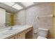 A clean bathroom with floral wallpaper and vanity at 5095 Bay Ne St # 109, St Petersburg, FL 33703
