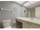A bright bathroom with a vanity, toilet, and shower at 5095 Bay Ne St # 109, St Petersburg, FL 33703