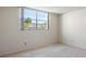 Bright bedroom with a window overlooking trees and buildings at 5095 Bay Ne St # 109, St Petersburg, FL 33703