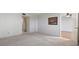 Empty carpeted bedroom with neutral walls and a door to the hallway at 5095 Bay Ne St # 109, St Petersburg, FL 33703