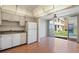 Kitchen with white cabinets and appliances at 5095 Bay Ne St # 109, St Petersburg, FL 33703