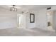 Living room with closet, bathroom entry and mirror at 5095 Bay Ne St # 109, St Petersburg, FL 33703