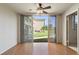 Living room with sliding doors leading to a grassy courtyard at 5095 Bay Ne St # 109, St Petersburg, FL 33703