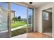 Living area with sliding doors opening to a green courtyard at 5095 Bay Ne St # 109, St Petersburg, FL 33703