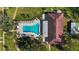Overhead view of community pool, lounge chairs, and clubhouse at 5095 Bay Ne St # 109, St Petersburg, FL 33703