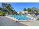 Inviting kidney-shaped pool with surrounding lounge chairs at 5095 Bay Ne St # 109, St Petersburg, FL 33703