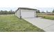 One-car garage with a newly constructed home and grassy yard at 3622 Moscato Dr, Brooksville, FL 34602