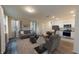 Open concept living room, dining area, and kitchen with hardwood floors at 11831 Sylvia St, Dade City, FL 33525