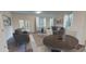 Open living and dining area with hardwood floors and access to a patio at 11831 Sylvia St, Dade City, FL 33525