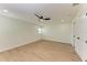 Well-lit bedroom with ceiling fan and double door closet at 1844 Riviera Cir, Sarasota, FL 34232