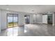 Spacious living room with sliding glass doors and barn door at 4185 Berkshire Dr, Sarasota, FL 34241