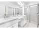 Stylish bathroom with double sinks, elegant lighting, and a glass-enclosed shower for a luxurious feel at 16126 Ivy Ridge Ct, Port Charlotte, FL 33953