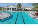 Community pool with a clubhouse and lounge area at 16126 Ivy Ridge Ct, Port Charlotte, FL 33953
