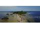 Birds-eye view of a sandbar surrounded by boats and ocean waters at 6728 Sea Ranch Dr, Hudson, FL 34667