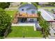 Aerial view of house with large deck and backyard at 6728 Sea Ranch Dr, Hudson, FL 34667