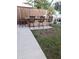 Backyard Bar Area with wooden plank bar and four stools at 6728 Sea Ranch Dr, Hudson, FL 34667