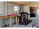 Unfinished basement with a treadmill, workbench, and bright natural light at 6728 Sea Ranch Dr, Hudson, FL 34667