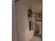 Small bathroom with pedestal sink and shelving at 6728 Sea Ranch Dr, Hudson, FL 34667
