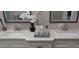 Bathroom with double vanity and white countertop at 6728 Sea Ranch Dr, Hudson, FL 34667