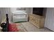 Bedroom with crib and dresser at 6728 Sea Ranch Dr, Hudson, FL 34667