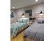 Guest bedroom with two twin beds and wood floors at 6728 Sea Ranch Dr, Hudson, FL 34667