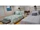 Guest bedroom with two twin beds and wood floors at 6728 Sea Ranch Dr, Hudson, FL 34667