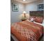 Bedroom with queen bed and wood nightstand at 6728 Sea Ranch Dr, Hudson, FL 34667