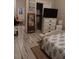 Bedroom with dresser, TV, and full-size bed at 6728 Sea Ranch Dr, Hudson, FL 34667
