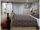 Primary bedroom with king bed and barn door at 6728 Sea Ranch Dr, Hudson, FL 34667