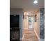 Hallway with hardwood floors and access to other rooms at 6728 Sea Ranch Dr, Hudson, FL 34667