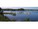 People enjoying the outdoors in kayaks on a tranquil lake at 6728 Sea Ranch Dr, Hudson, FL 34667