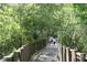 Scenic nature trail with wooden railings, perfect for relaxing walks at 6728 Sea Ranch Dr, Hudson, FL 34667